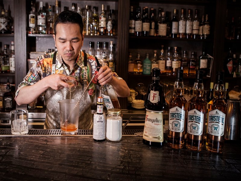 Bartender Using Jigger