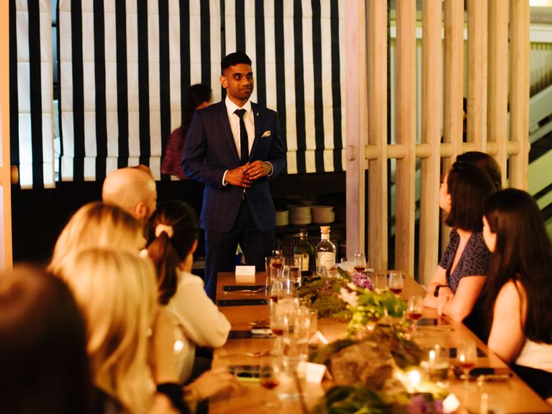 Diplomatico brand ambassador talks to guest seated for the event, with diplomatico and canaima bottlings on show